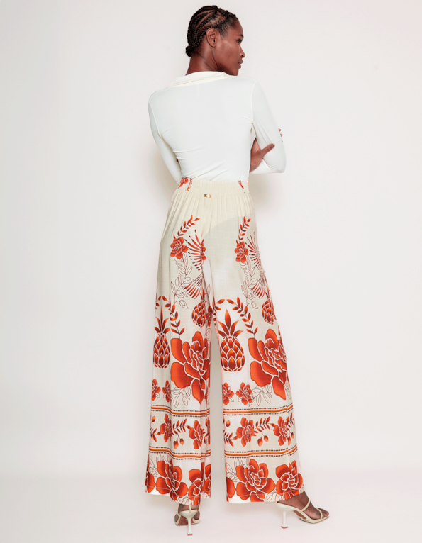calça wide leg estampada tropical laranja